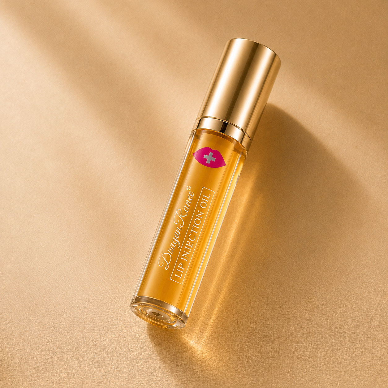 Gold Lip injection oil bottle with on a beige background